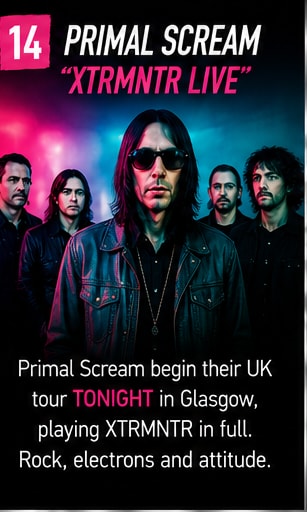 Bobby Gillespie and Primal Scream on stage bathed in red and white strobe lights.