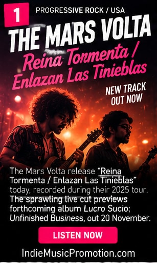 The Mars Volta performing live on stage under red and amber concert lights.