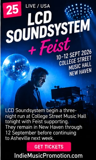 James Murphy of LCD Soundsystem on stage next to a sparkling mirror ball under blue spotlight.