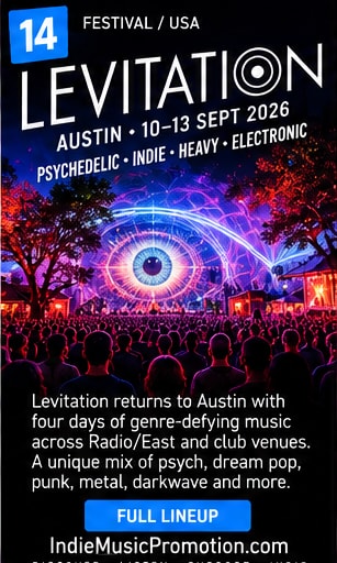 Psychedelic eye visual projection glowing over a crowded Levitation festival concert audience.
