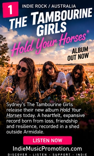 The Tambourine Girls standing in an open grassy field under golden hour sunlight.