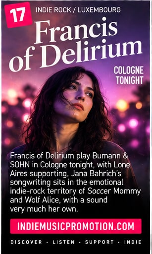 Jana Bahrich of Francis of Delirium looking upward in dramatic concert stage lights for Bumann & SOHN show in Cologne.