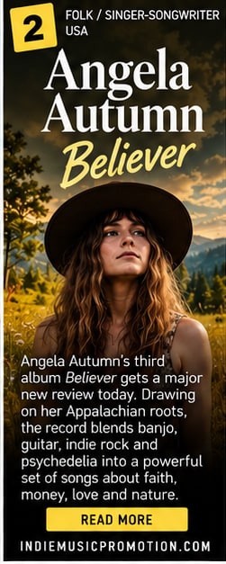 Angela Autumn wearing a brown fedora with acoustic guitar in Appalachian mountain golden hour.